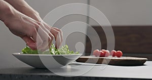 Add frisee salad leaves into white bowl