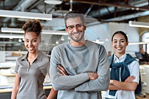 Add ingredient in your success. Young colleagues posing in office