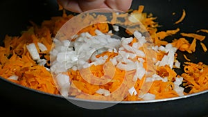 Add onion to carrots to roasting pan