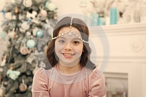 Add some glitz and glam to your look. Happy girl smile with Christmas look. New year eve party look of small child. Give photo