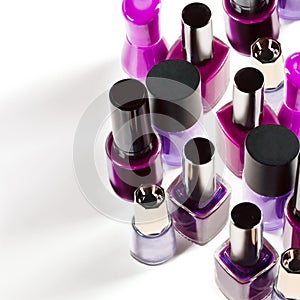 Add some purple into your beauty. Studio shot of colorful nail varnish bottles.