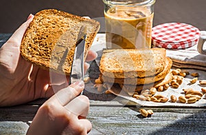 Add to ruddy toast peanut butter, hand, delicious breakfast