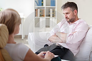 Addicted businessman on psychotherapy session