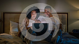 Addicted computer internet couple happy family girlfriend and boyfriend African American man and woman using laptop