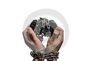 Addicted gaming player`s hands with joystick chained in chains isolated on white background