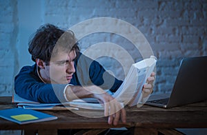 Addicted to internet young man hooked on the computer laptop late at night