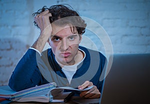 Addicted to internet young man hooked on the computer laptop late at night