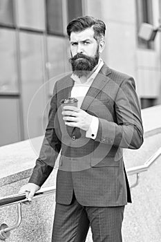 Addicted to style. formal man in office suit drinking coffee from paper cup. good morning coffee. take away drink