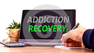 Addiction recovery symbol. Concept words Addiction recovery on beautiful black tablet. Beautiful white background. Calculator.