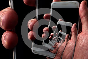 Addictive social media and the dangers of smartphone abuse concept theme with hand holding phone on black and vortex creating a