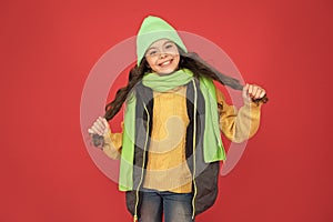 Adding care to your hair. Happy child with long hair. Small girl smile in winter style. Hair salon. Hairdressers parlor