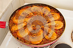 Adding Fried Shrimp to Paella Culinary Harmony