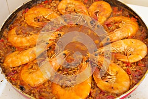 Adding Fried Shrimp to Paella Culinary Harmony