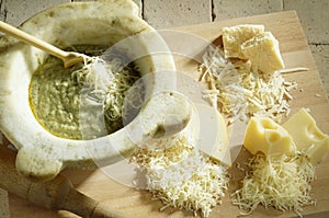 Adding the grated cheese to the preparation