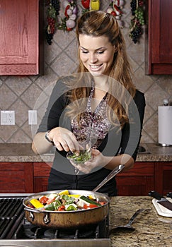 Adding herbs to dish