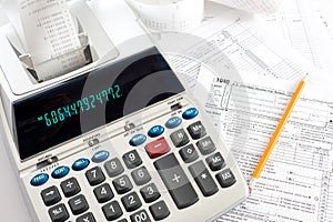 Adding Machine with tax forms photo