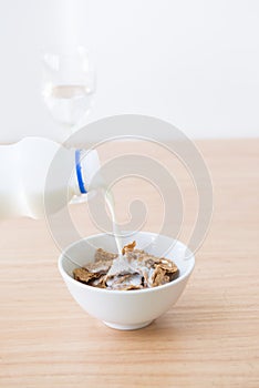 Adding milk to cornflake