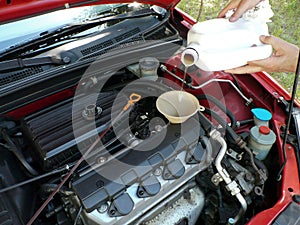 Adding Motor Oil to Car