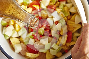 Adding sauce to salad