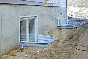 Adding window well to basement of a new house under construction