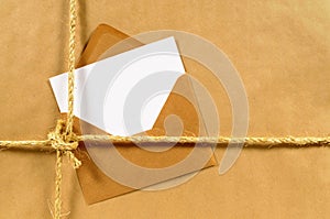 Address label or delivery card, brown paper parcel background, copy space