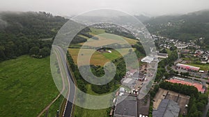 Adenau Germany, Race track aerial drone view in the Eifel on a cloudy day.