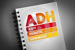 ADH - Antidiuretic Hormone acronym on notepad, concept background photo