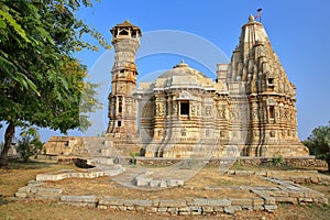 Adhbudhnath Shiva Temple, located inside the fort Garh of Chittorgarh, Rajasthan, India, with the Tower of Fame on the left side