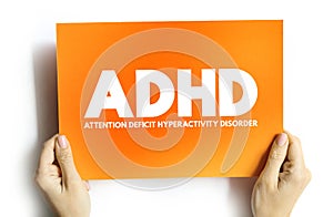 ADHD - Attention Deficit Hyperactivity Disorder acronym on card, medical concept background