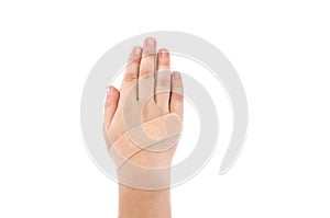 Adhesive bandage on a child`s hand isolated on white background with copy space.