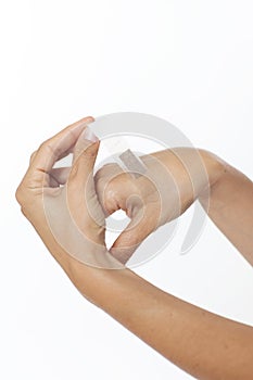 Adhesive bandage on hand