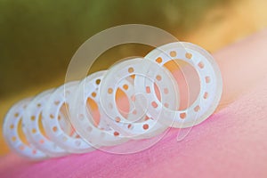 Adhesive tape for dispenser on a gold and pink background. Items for office work