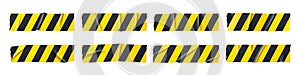 Adhesive tape pieces with black and yellow stripes