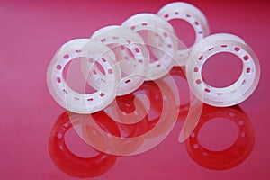 Adhesive tape on a red background. Items for office work