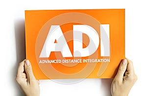 ADI - Advanced Distance Integration acronym on card, concept background