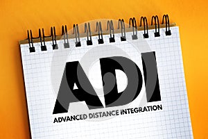 ADI - Advanced Distance Integration acronym text on notepad, concept background