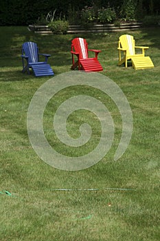 Adirondack chairs on manicured lawn