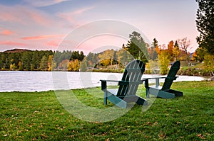 Adirondack Chairs near the Shore of a Lake at Dusk