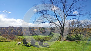 Adirondack Chairs on Scenic Overlook in Fall