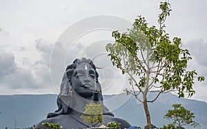 Adiyogi Shiva statue Coimbatore with velliangiri mountains background photo