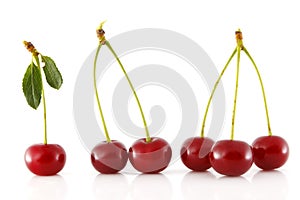 Adjacent cherries with stem