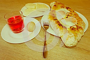 Adjarian khachapuri close-up. This traditional georgian dish con