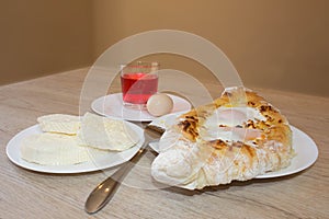 Adjarian khachapuri close-up. This traditional georgian dish contains brinsen cheese, butter and row egg