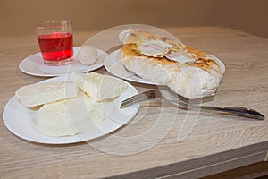 Adjarian khachapuri close-up. This traditional georgian dish contains brinsen cheese, butter and row egg