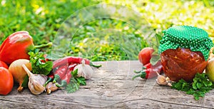 Adjika in a jar, canned. Selective focus