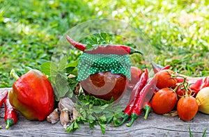 Adjika in a jar, canned. Selective focus.
