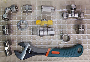Adjust wrench power grip and elements of water and gas shutoff valves, flat lay