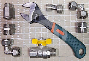 Adjust wrench power grip and elements of water and gas shutoff valves, flat lay