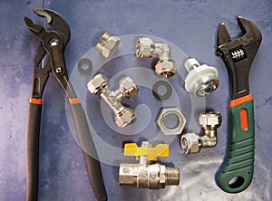 Adjust wrench power grip, groove joint pillers and elements of water and gas shutoff valves, flat lay