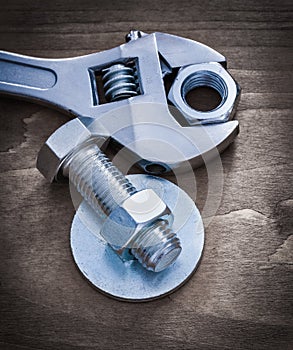 Adjustable spanner bolt washer screw-nut and bolt on wood board